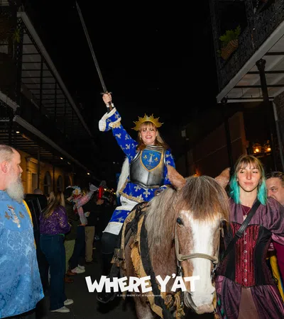 a man riding a horse with a woman on the back