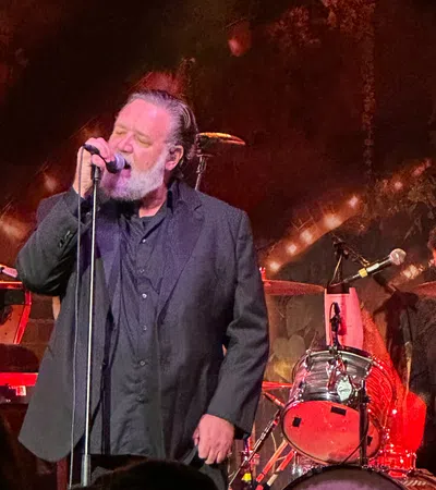 a man singing into a microphone