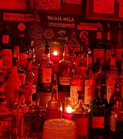 a bar with many bottles of alcohol