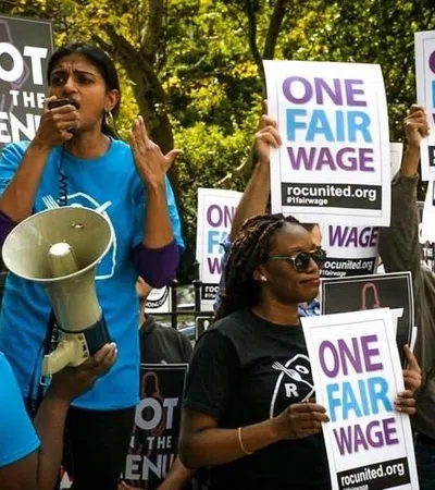 a group of people holding signs