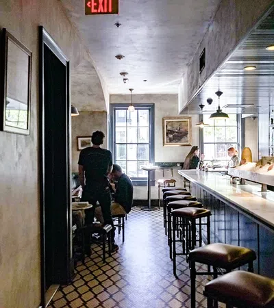 a restaurant with a bar and stools