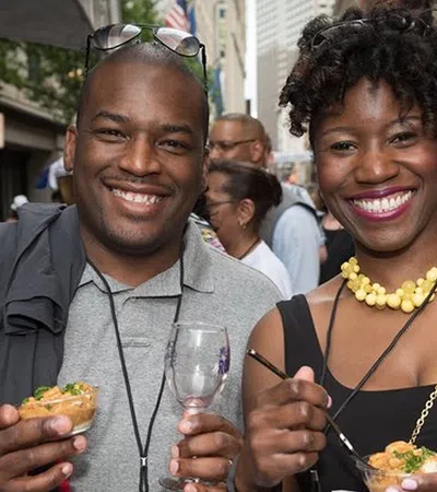 a man and woman holding drinks
