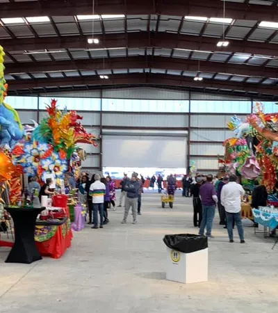 a large room with people and balloons