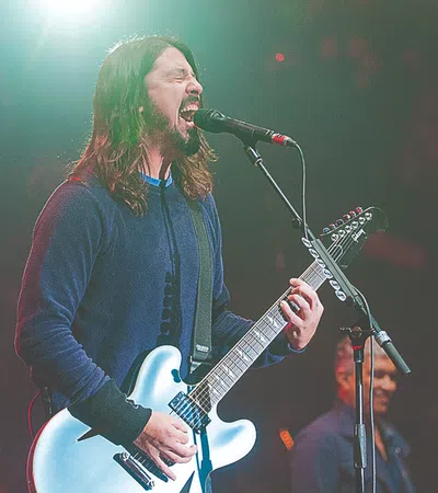 a person singing into a microphone