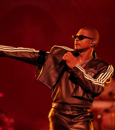 a man wearing sunglasses and a microphone