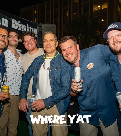 a group of men posing for a photo