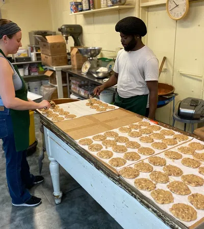a man and a woman preparing food