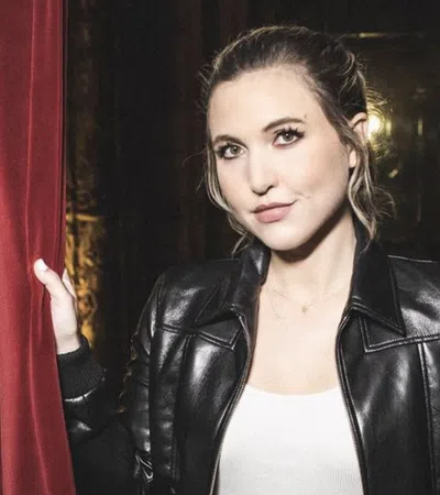 a woman in a leather jacket
