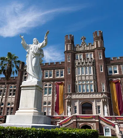 a statue in front of a building