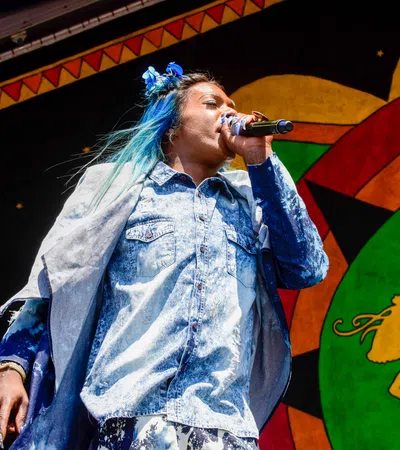 a person singing into a microphone