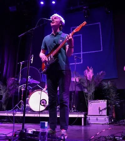 a group of people playing instruments on a stage