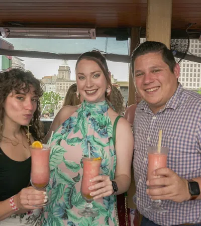 Kendra Sayles et al. holding drinks