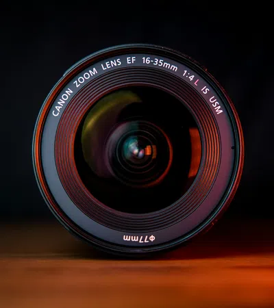 Canon EF 16-35mm f/4L USM zoom lens showcased against a dark background.