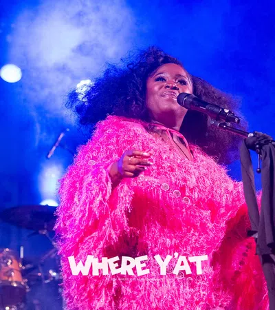 a person singing into a microphone