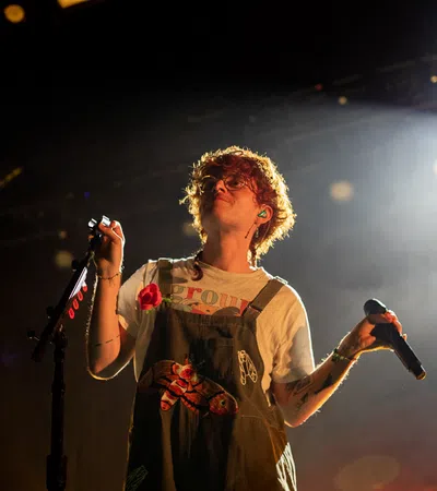 a person singing into a microphone