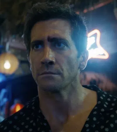 Jake Gyllenhaal with a black and white shirt and a black and white polka dot scarf