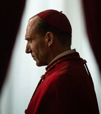 a man in a red hat and gown