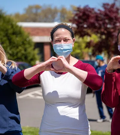 a group of women wearing face masks