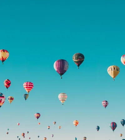 a group of hot air balloons in the sky