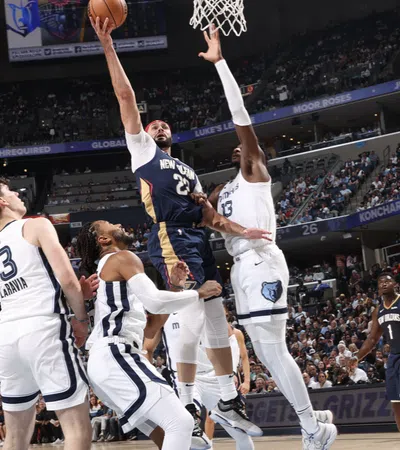 a group of men playing basketball