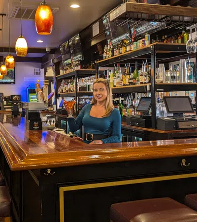 a person sitting at a bar