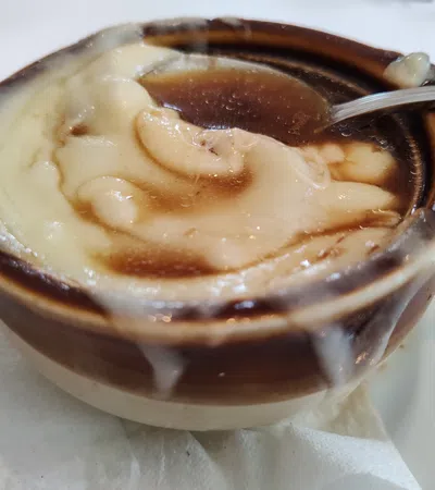 a cup of coffee with a spoon