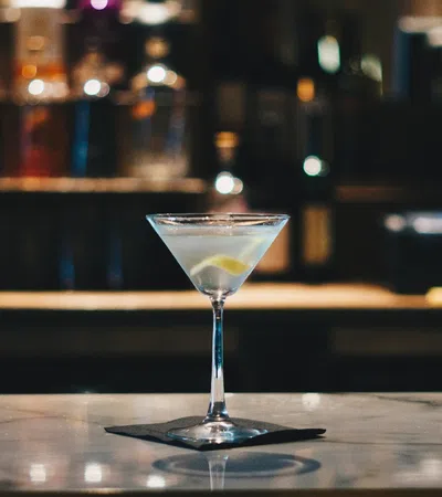 a glass of white liquid on a table