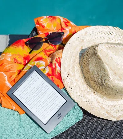 a hat and a book on a blanket