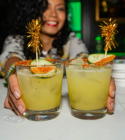 a person holding a drink