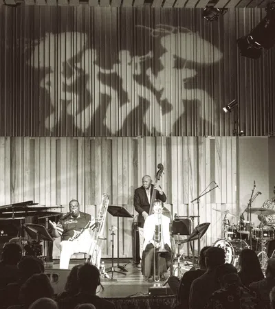 a group of people playing instruments on a stage