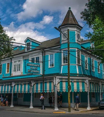 a blue building with a green roof