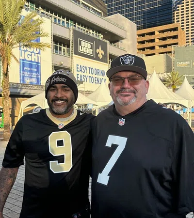 two men wearing black shirts