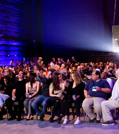 a group of people sitting in chairs