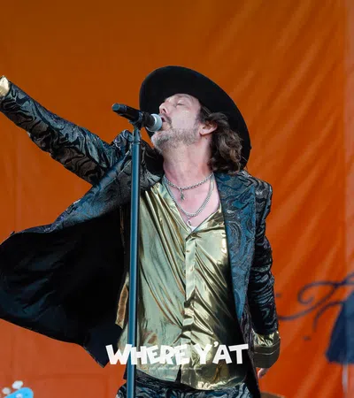a man singing into a microphone