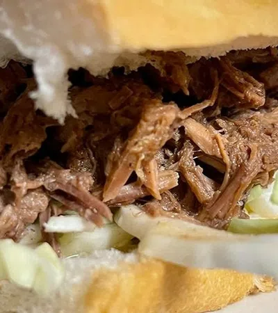 a sandwich with meat and vegetables