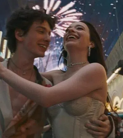 a man and woman holding each other