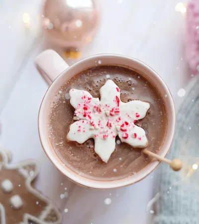 a cup of coffee with a flower on the side