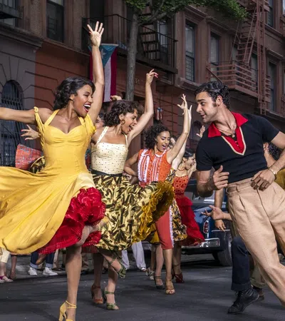 a group of people dancing in a street