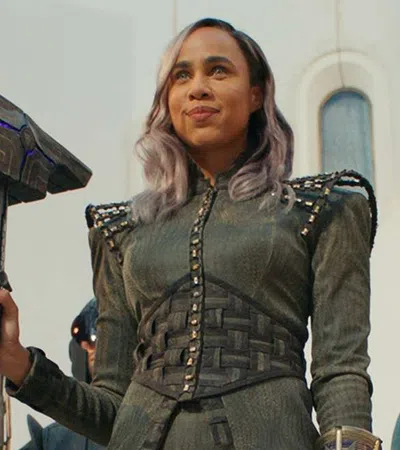 Zawe Ashton holding a gun