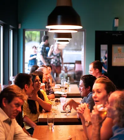 a group of people sitting at a table