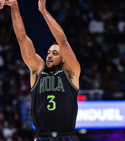 C.J. McCollum holding the arms up