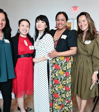 a group of women posing for a photo