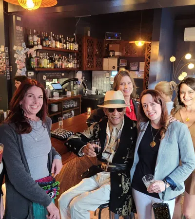a group of women posing for a photo