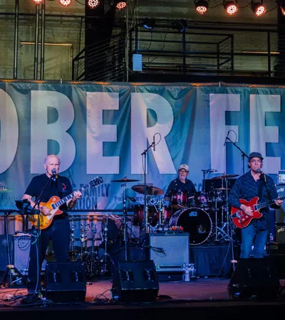 a group of people playing instruments on a stage