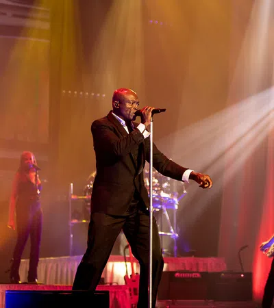 a person singing on a stage