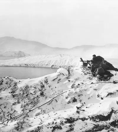 a person sitting on a snowy mountain