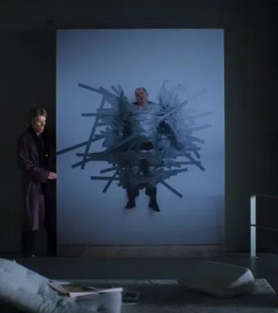 a person standing in front of a projector screen