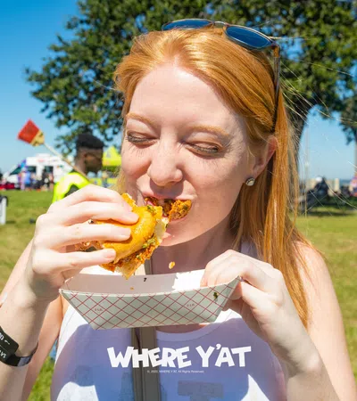 a person eating a hot dog