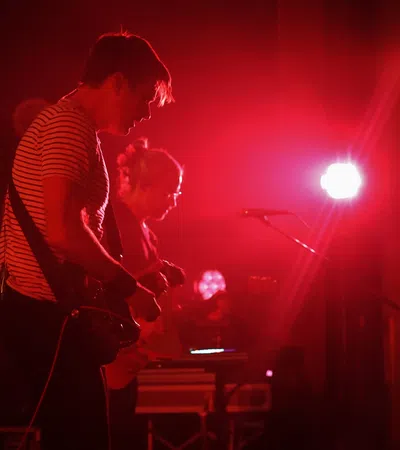 a man playing a guitar on a stage
