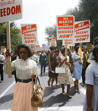 a group of people marching in the street